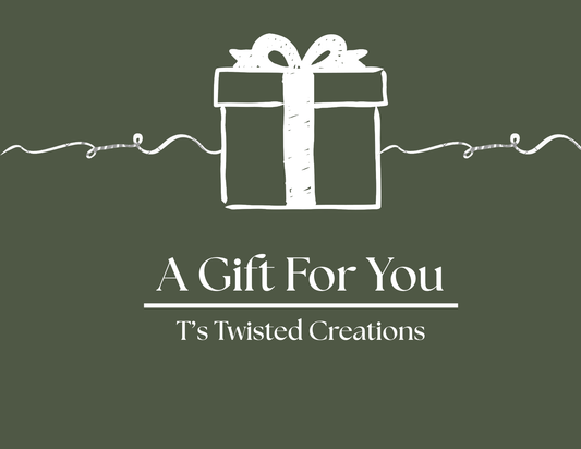 White gift box with bow on a green background, featuring text 'A Gift For You' and 'T's Twisted Creations'.